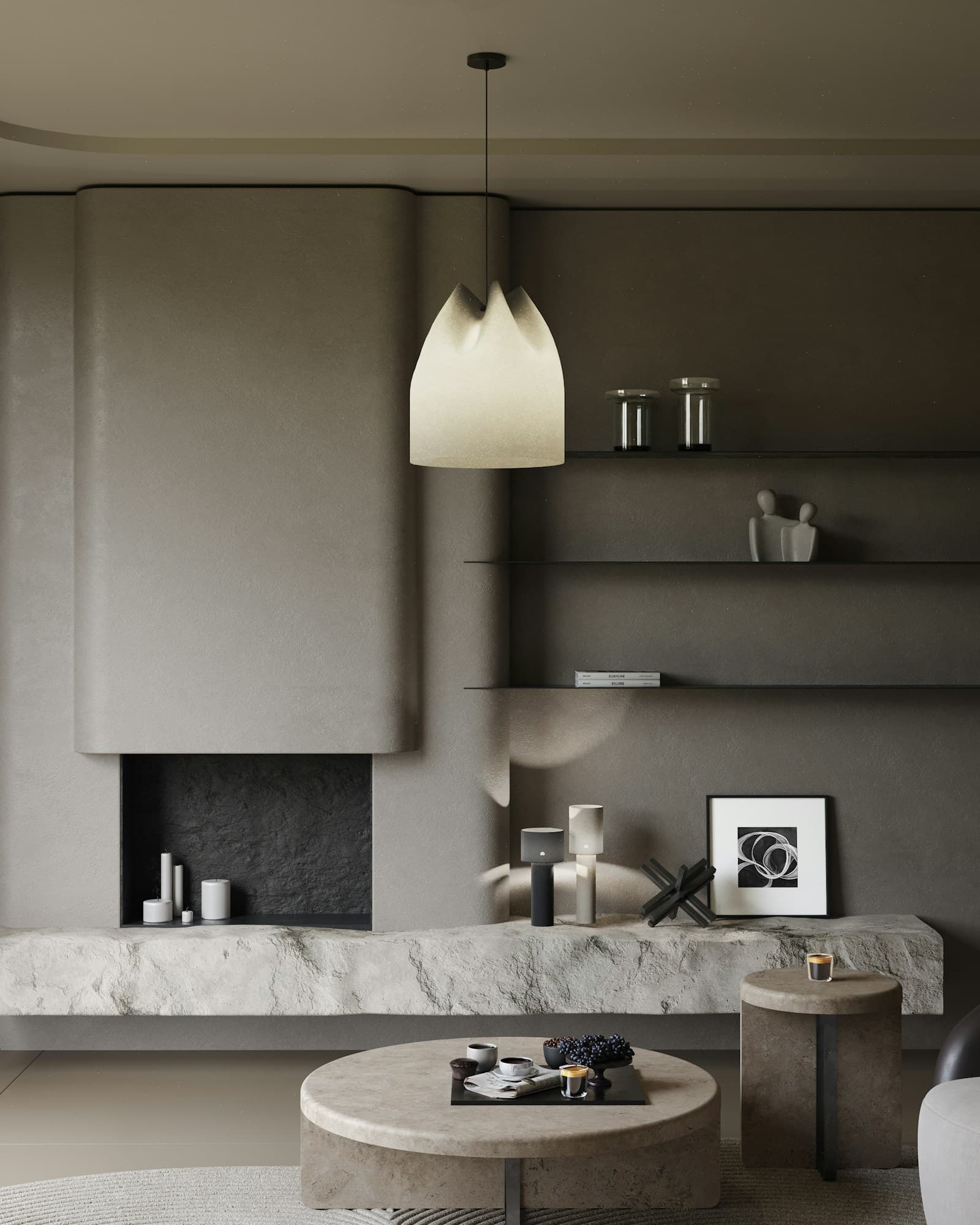 Quiet stone-walled lounge with a fireplace and pendant light
